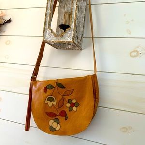 Hobo adjustable crossbody w leather and suede stitched flowers
